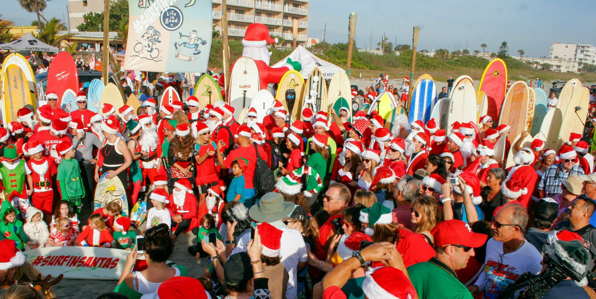 Surfing Santas catch waves at Cocoa Beach