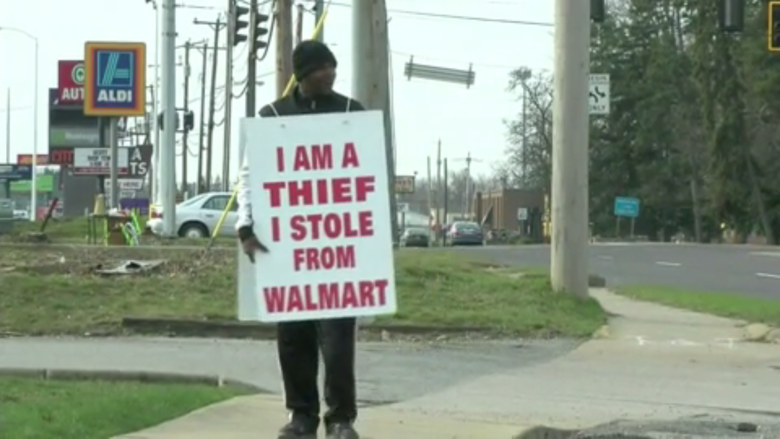 Man Chooses To Wear I Am A Thief Sign Over Going To Jail