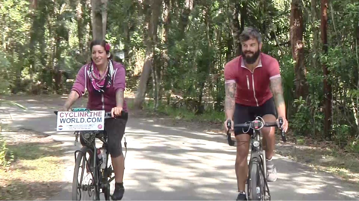 Couple cycling through North America makes SWFL stops - WINK News