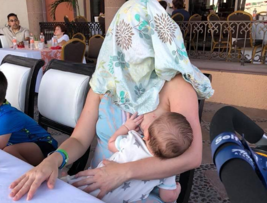 woman breastfeeding herself