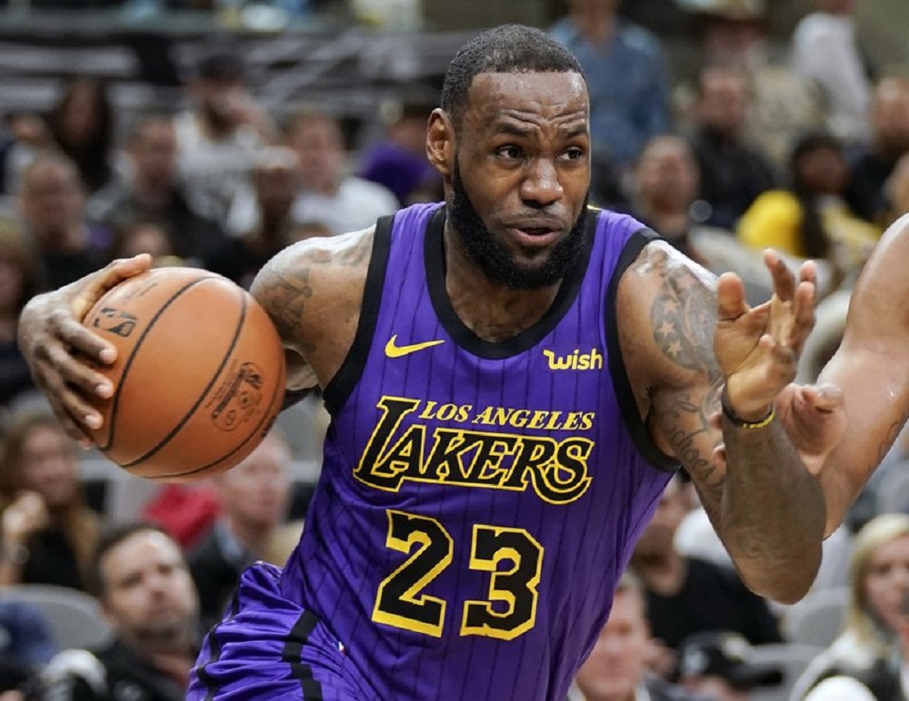 In this Dec. 7, 2018, file photo, Los Angeles Lakers' LeBron James (23) drives against the San Antonio Spurs during the first half of an NBA basketball game, in San Antonio. LeBron James was named The Associated Press Male Athlete of the Year on Thursday, Dec. 27, 2018. Photo via AP/Darren Abate.