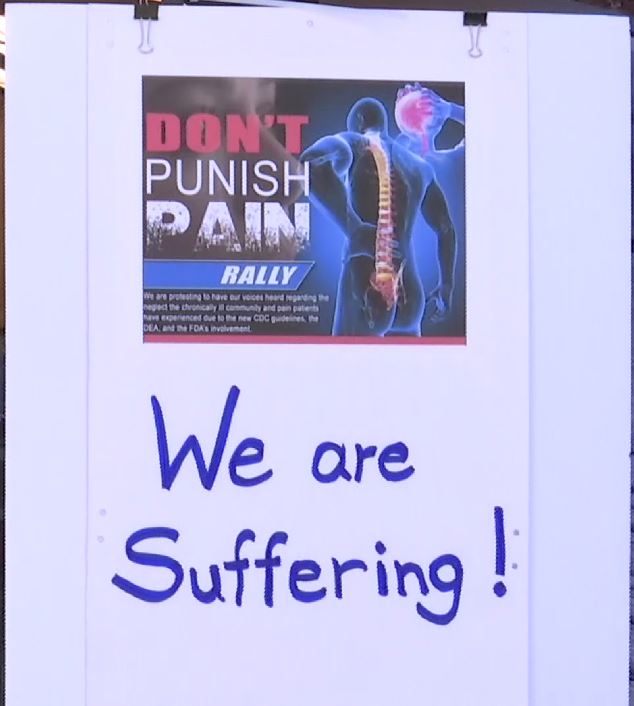 Sign at the Don't Punish Pain rally. (WINK News photo.)