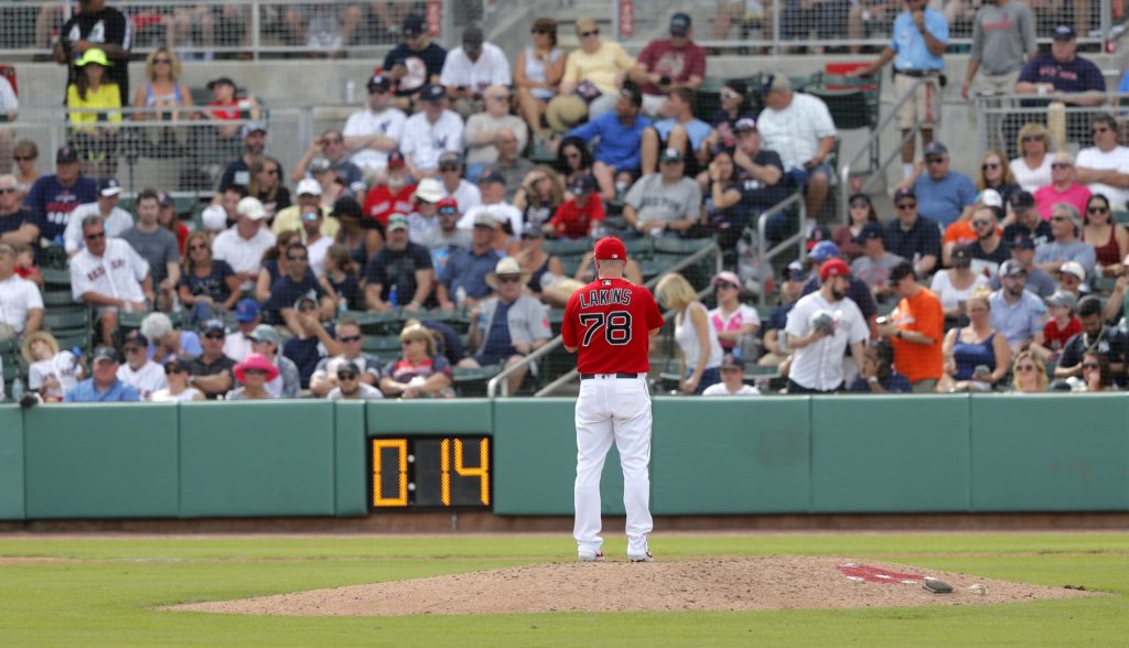 Slowly, baseball rolls out pitch clock in spring training