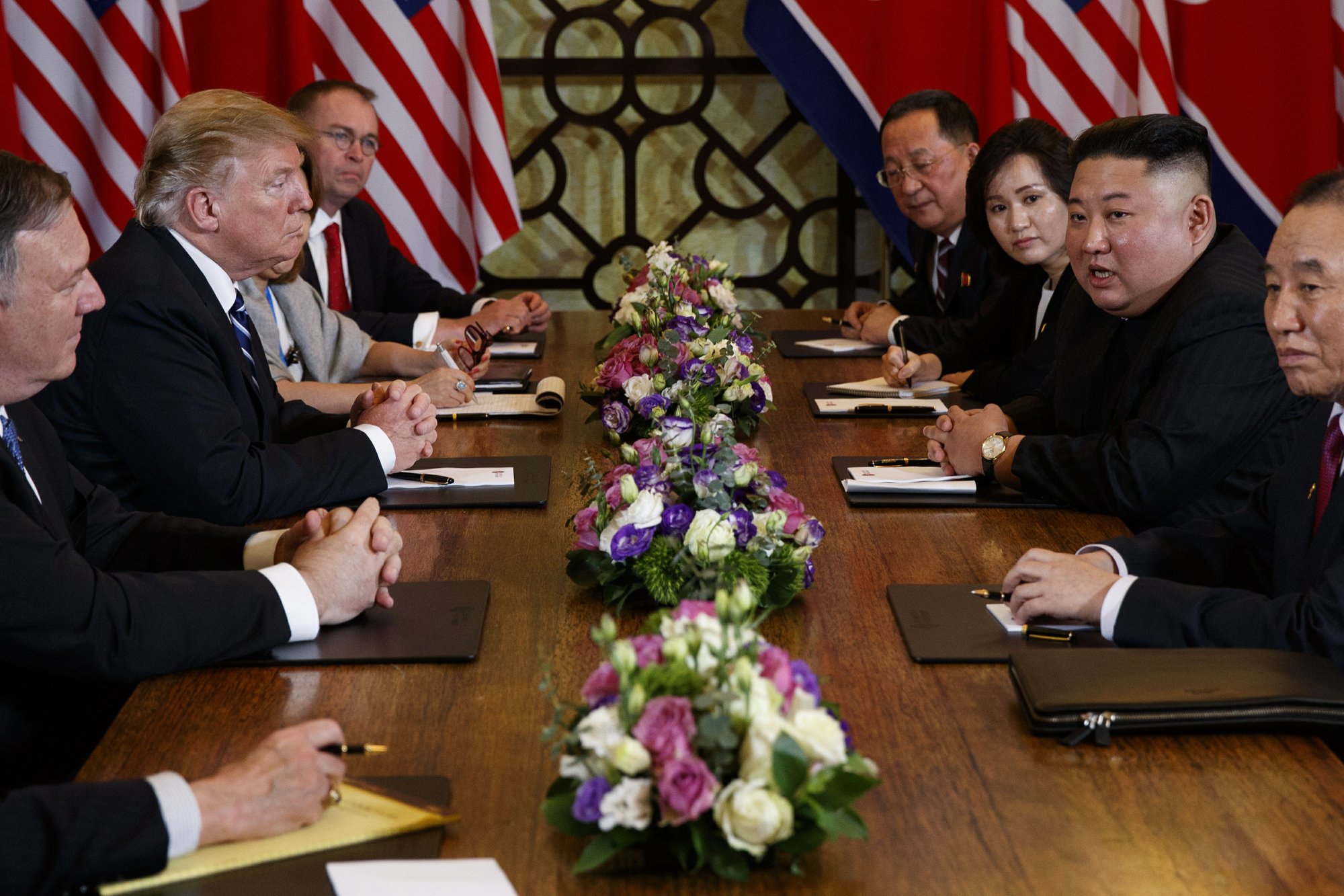 President Donald Trump speaks during a meeting with North Korean leader Kim Jong Un Thursday, Feb. 28, 2019, in Hanoi. At front right is Kim Yong Chol, a North Korean senior ruling party official and former intelligence chief. At left is Secretary of State Mike Pompeo, second from left. (AP Photo/ Evan Vucci)