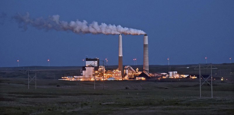 FILE - In this May 25, 2017, file photo, the Milton R. Young Station lignite coal-fired power plant near Center, N.D., glows as dusk blankets the North Dakota prairie landscape. The U.S. Environmental Protection Agency announced Tuesday, Feb. 26, 2019, it will retain the standard for sulfur dioxide pollution established in 2010 under President Barack Obama. Sulfur dioxide comes from burning coal to produce electricity and from other industrial sources. (Tom Stromme/The Bismarck Tribune via AP, File)