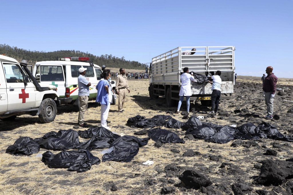 Rescuers remove body bags from the scene of an Ethiopian Airlines flight that crashed shortly after takeoff at Hejere near Bishoftu, or Debre Zeit, some 50 kilometers (31 miles) south of Addis Ababa, in Ethiopia Sunday, March 10, 2019. (Credit: AP)