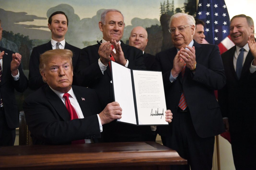 resident-Donald-Trump-holds-up-a-signed-proclamation-recognizing-Israels-sovereignty-over-the-Golan-Heights.-Credit-AP-1068x712.jpeg