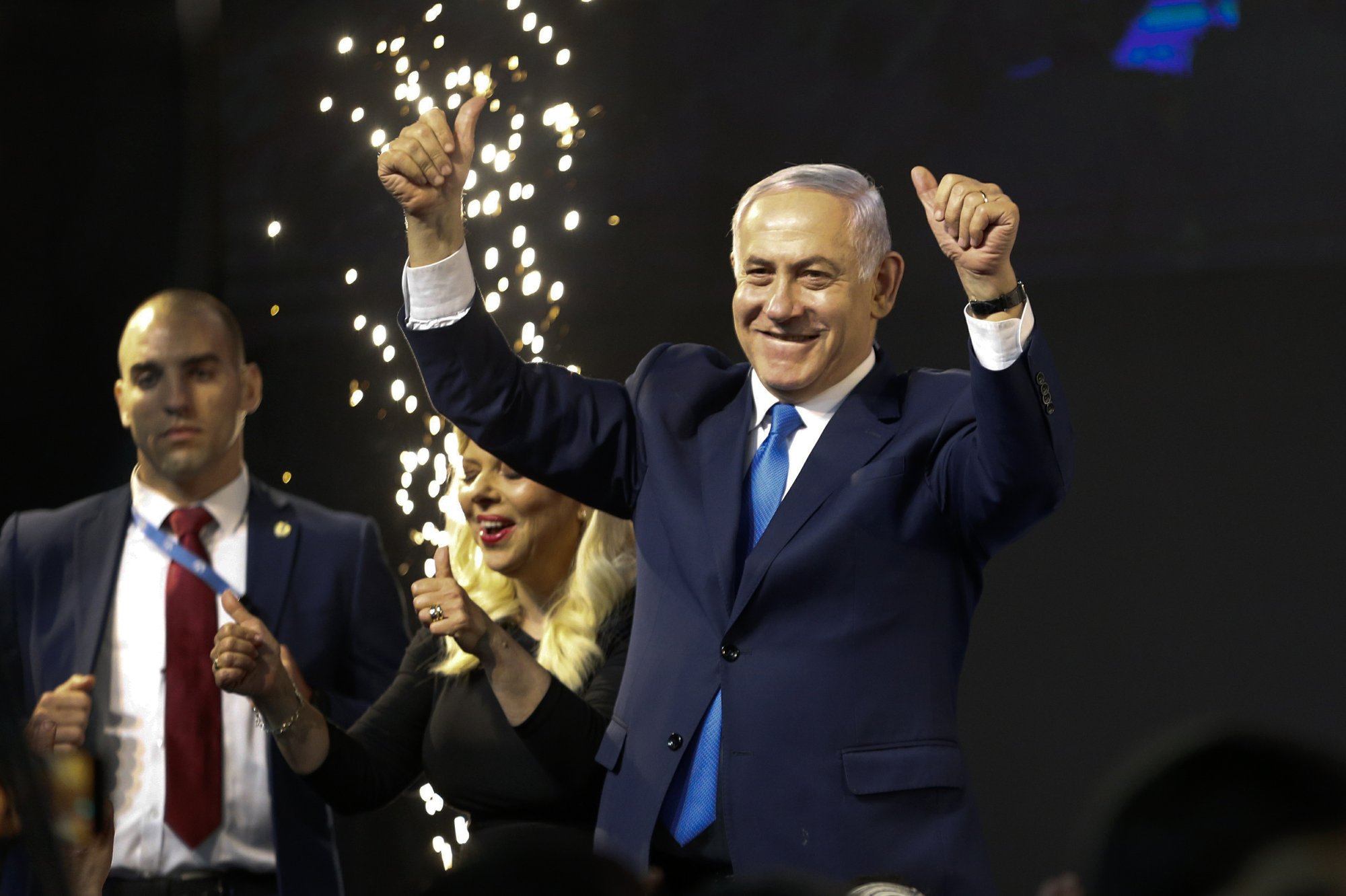 Israel's Prime Minister Benjamin Netanyahu waves to his supporters after polls for Israel's general elections closed in Tel Aviv, Israel, Wednesday, April 10, 2019. (AP Photo/Ariel Schalit)