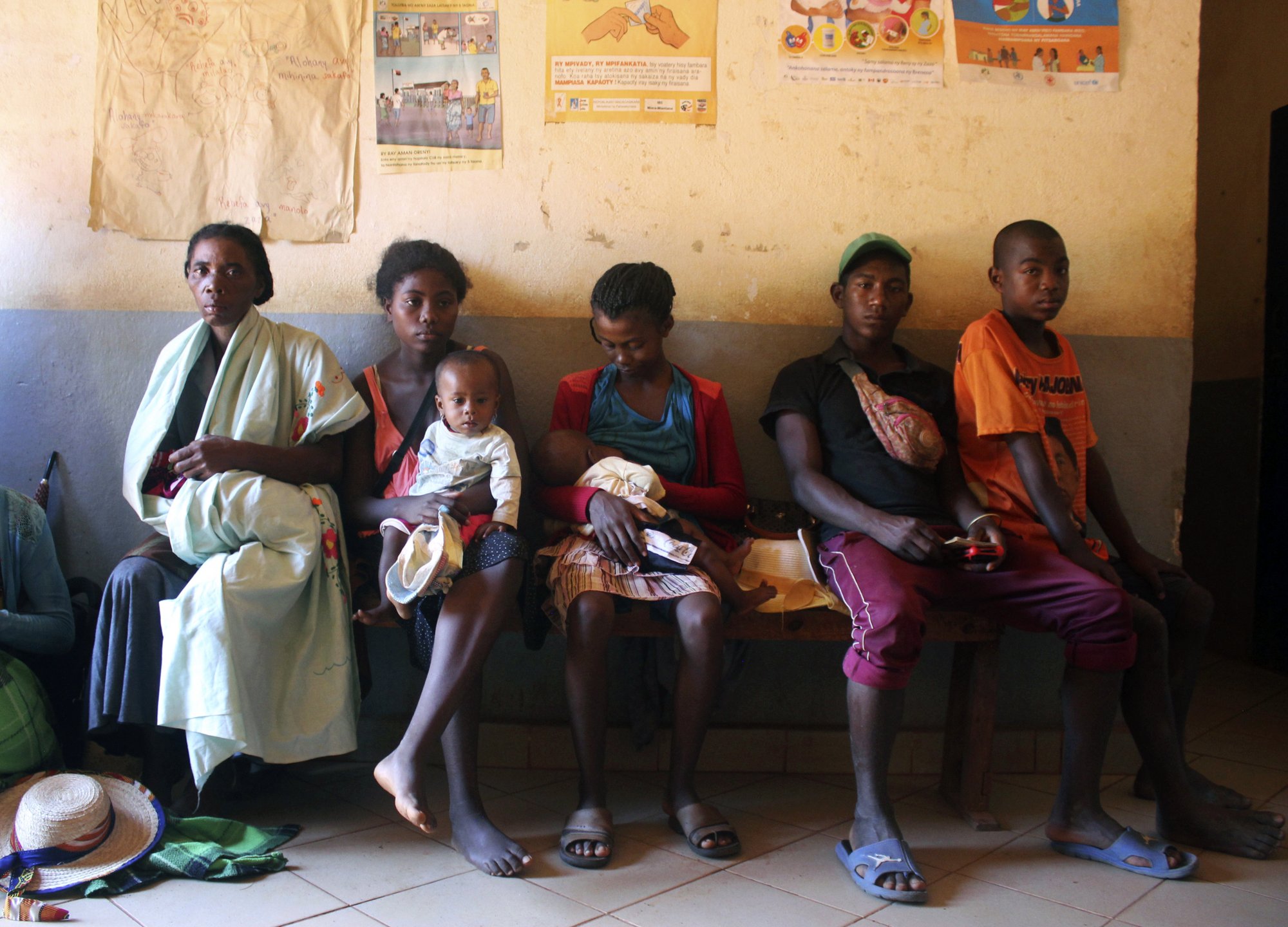 In this photo taken Thursday, March 21, 2019, mothers wait to have their babies vaccinated against measles, at a healthcare center in Larintsena, Madagascar. As the island nation faces its largest measles outbreak in history and cases soar well beyond 115,000, the problem is not centered on whether to vaccinate children. Many parents would like to do so but face immense challenges including the lack of resources and information. (AP Photo/Laetitia Bezain)