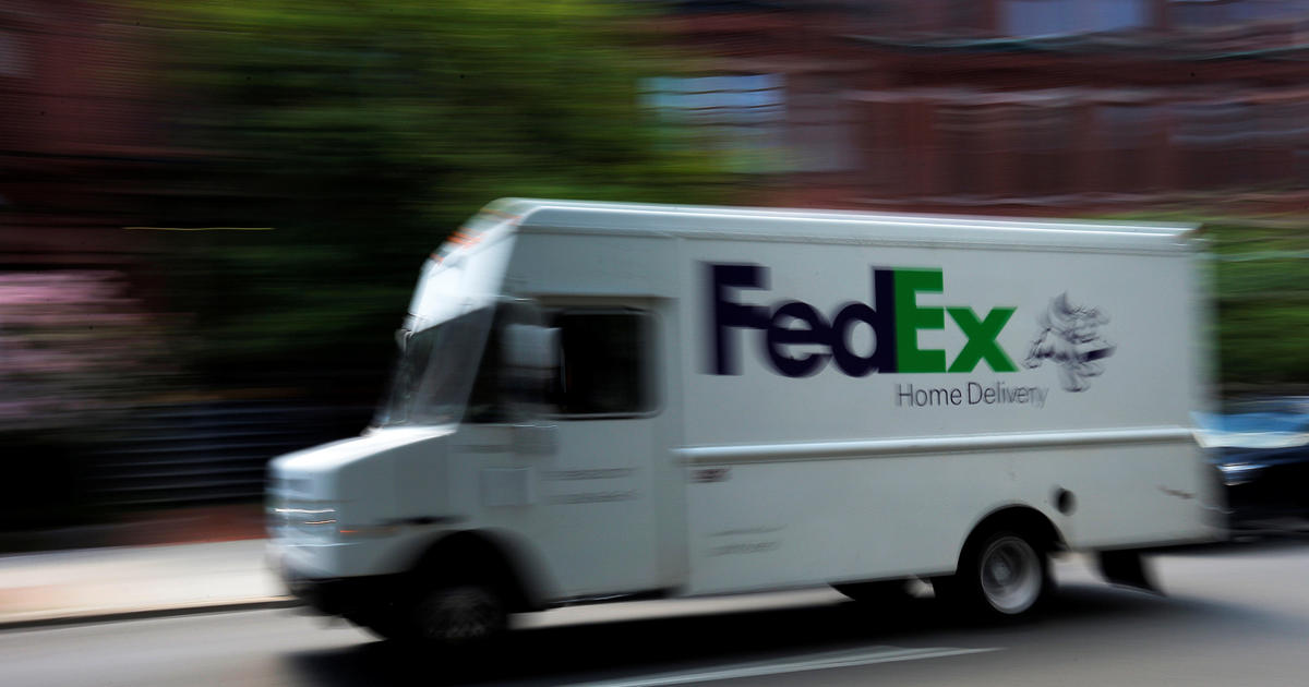 FedEx truck makes a delivery. (Credit: CBS News)