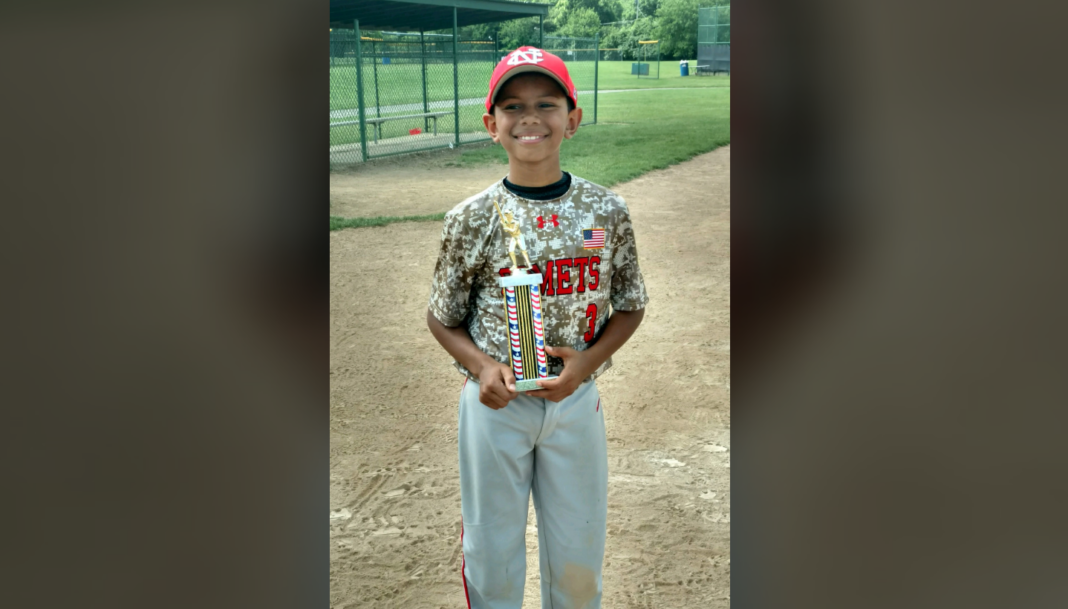 John Mullins, 11 years old, collpses on the baseball field. (Credit: CBS)