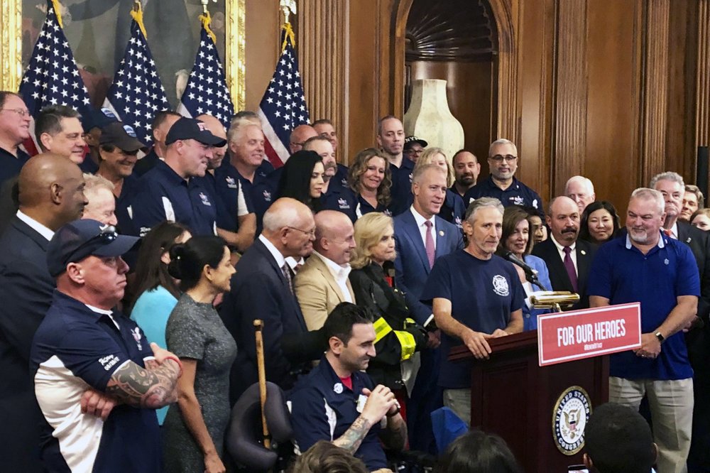 Entertainer and activist Jon Stewart, speaks at a news conference on behalf of 9/11 victims and families, Friday, July 12, 2019, at the Capitol in Washington. The House is expected to approve a bill Friday ensuring that a victims' compensation fund for the Sept. 11 attacks never runs out of money. (AP Photo/Matthew Daly)