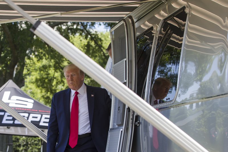 President Donald Trump steps out of an Airstream trailer from Ohio, during a Made in America showcase on the South Lawn of the White House, Monday, July 15, 2019, in Washington. (AP Photo/Alex Brandon)
