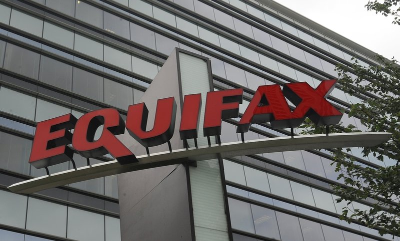 FILE - This July 21, 2012, file photo shows signage at the corporate headquarters of Equifax Inc., in Atlanta. Equifax will pay up to $700 million to settle with the Federal Trade Commission and others over a 2017 data breach that exposed Social Security numbers and other private information of nearly 150 million people. The proposed settlement with the Consumer Financial Protection Bureau, if approved by the federal district court Northern District of Georgia, will provide up to $425 million in monetary relief to consumers, a $100 million civil money penalty, and other relief. (AP Photo/Mike Stewart, File)