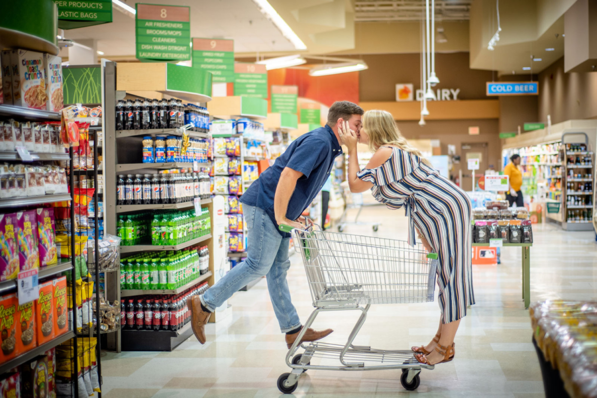 Alexandra Darch and her fiance, Dylan Smith, posing in one of their engagement photos at Publix. (Credit:: Jennifer Goodlet Photography)