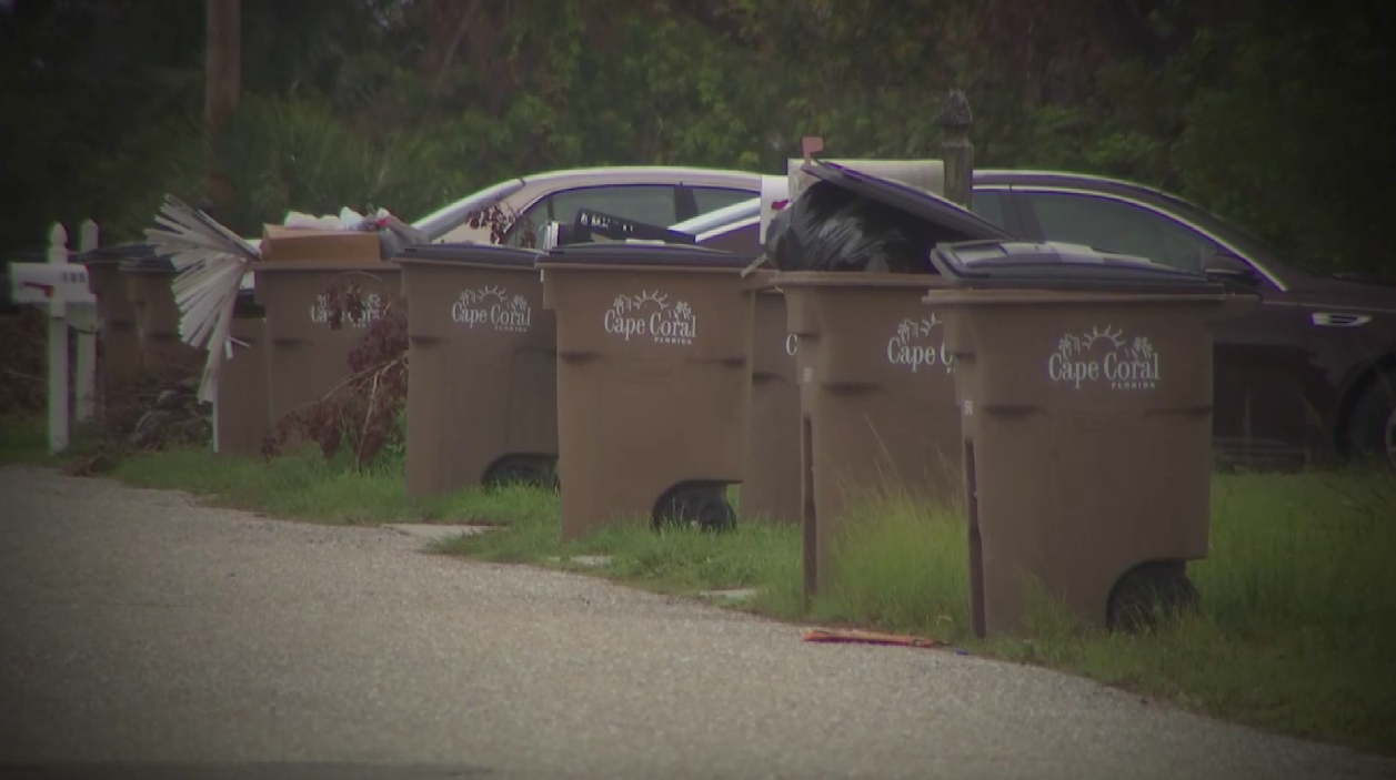 Trash cans line the streets in Cape Coral (WINK News)
