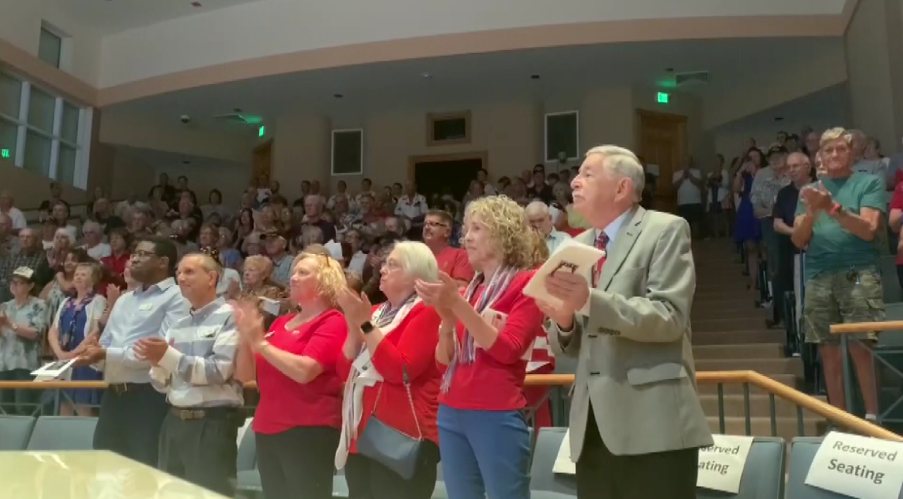 Attendees applaud at the ceremony on Veterans Day. (Credit: WINK News)