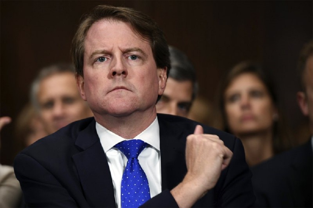 FILE - In this Sept. 27, 2018, file photo, then-White House counsel Don McGahn listens as Supreme court nominee Brett Kavanaugh testifies before the Senate Judiciary Committee on Capitol Hill in Washington. A federal judge has ordered McGahn to appear before Congress in a setback to President Donald Trump’s effort to keep his top aides from testifying. The outcome could lead to renewed efforts by House Democrats to compel testimony from other high-ranking officials, including former national security adviser John Bolton. (Saul Loeb/Pool Photo via AP, File)