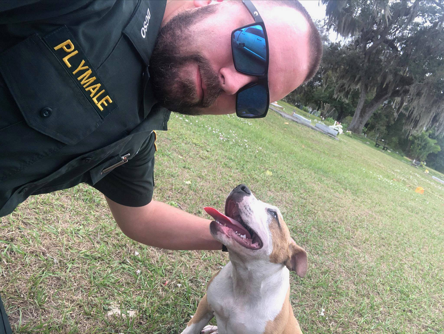 Corporal Plymale and rescued pup. (Credit: DeSoto County Sheriff's Office)