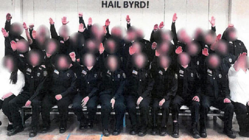 The photo made national news in early December. Two instructors and a cadet were fired at the time, and 34 other people, including everyone else in the photograph, were suspended. (Credit: CBS News)