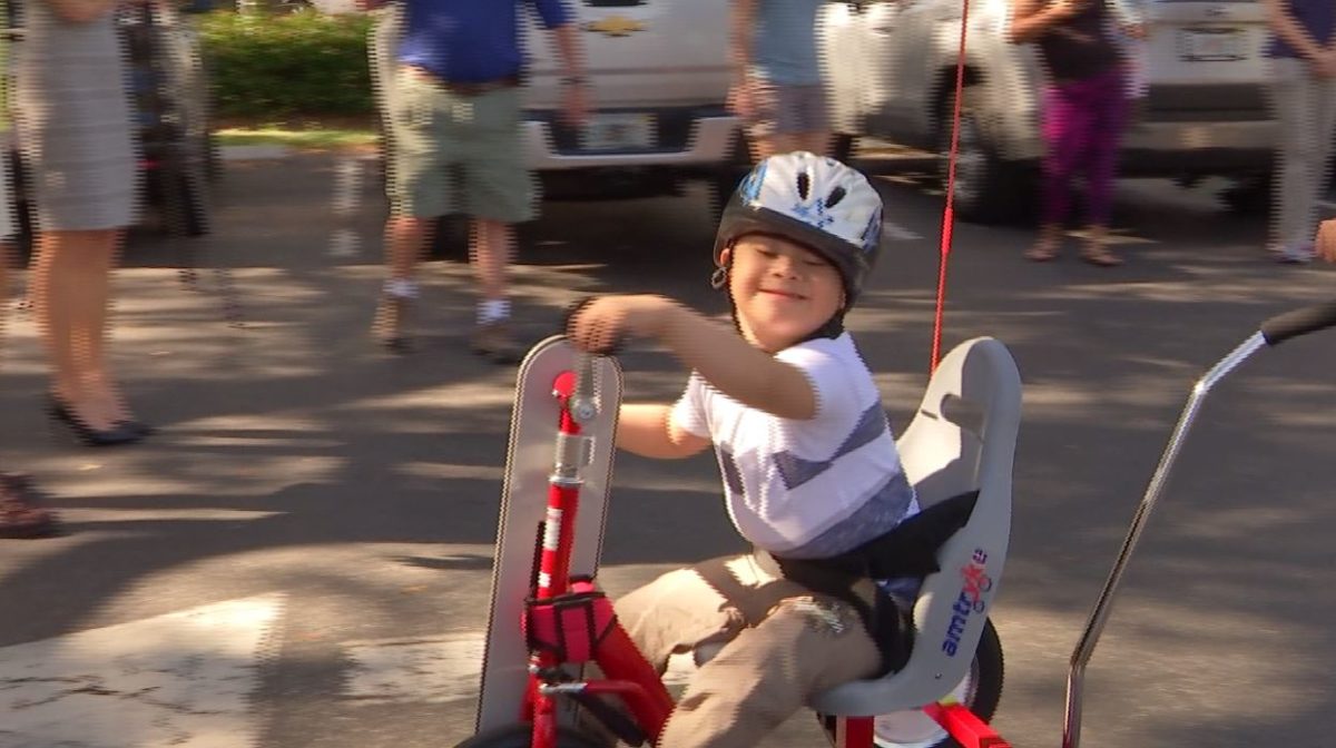 One of the kids with his new bicycle. (Credit: WINK News)