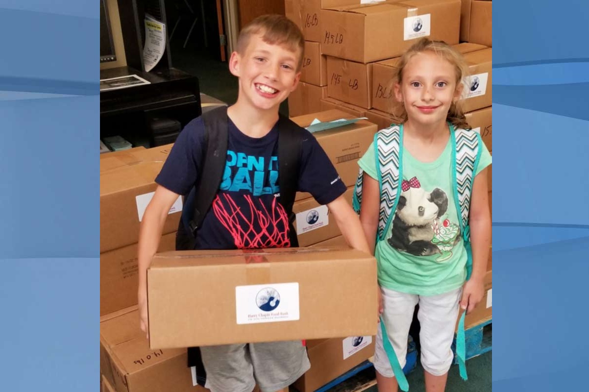 Two kids who are recipients of food provided by your donations. (Credit: Harry Chapin Food Bank)