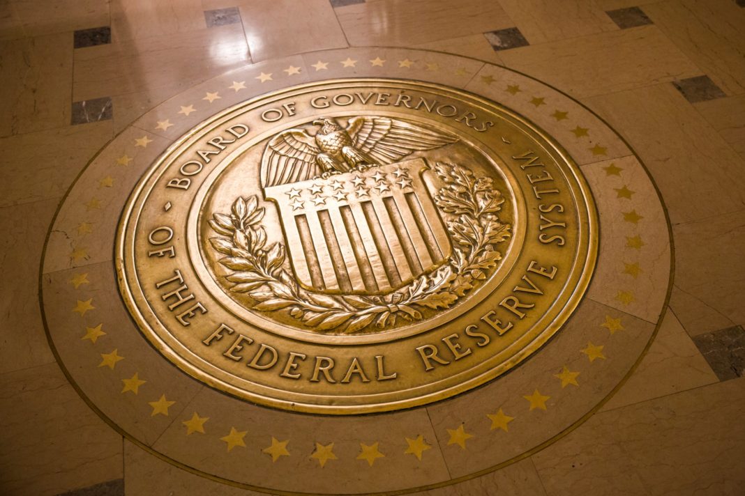 The Federal Reserve held interest rates steady despite renewed pressure from President Donald Trump to make deeper cuts. Pictured here, a gold plated seal inside the Eccles Building, the place of the Board of Governors of the Federal Reserve System and of the Federal Open Market Committee. (Credit: Brooks Kraft/Corbis News/Getty Images via CNN)