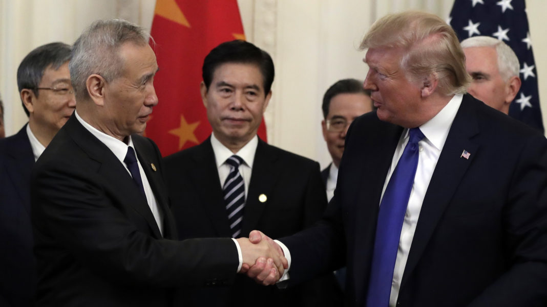 President Donald Trump shakes hands with Chinese Vice Premier Liu He, after signing a trade agreement in the East Room of the White House, Wednesday, Jan. 15, 2020, in Washington. (AP Photo/Evan Vucci)