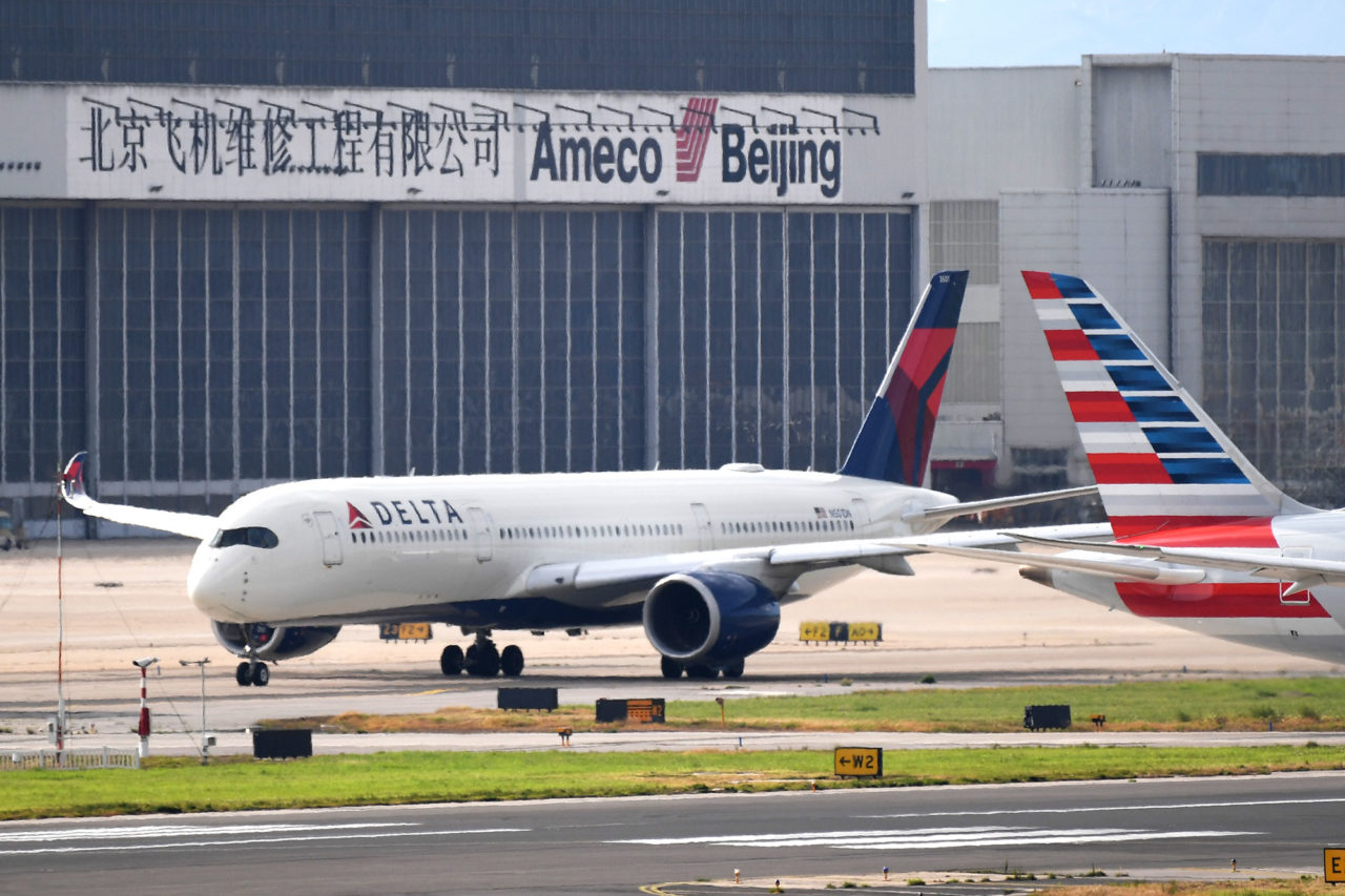 A Delta Airlines Airbus A350 aircraft waits to take off at Beijing airport on July 25, 2018. - Beijing hailed "positive steps" as major US airlines and Hong Kong's flag carrier moved to comply on July 25 with its demand to list Taiwan as part of China, sparking anger on the island. (Photo by GREG BAKER / AFP) (Photo credit should read GREG BAKER/AFP via Getty Images)