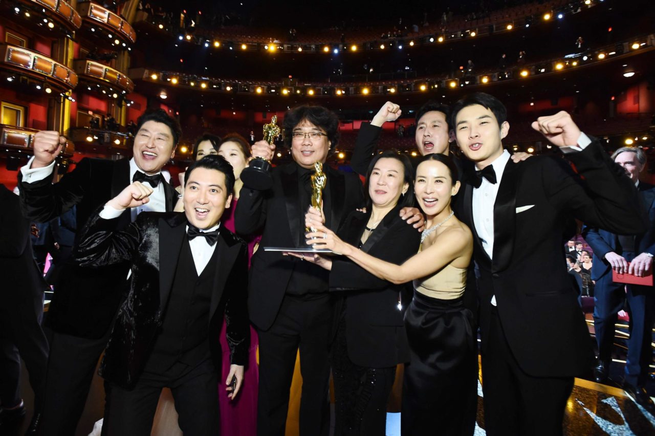 Best Picture Award winners for "Parasite" pose onstage during the 92nd Annual Academy Awards. The awards show drew an average of 23.6 million viewers for ABC on Sunday -- a new low for Hollywood's biggest night. (Credit: Handout/Getty Images North America/A.M.P.A.S. via Getty Images)