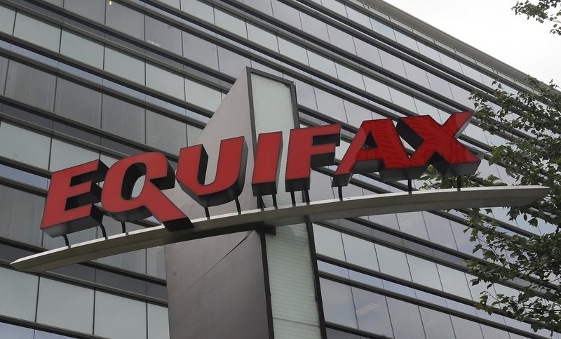 FILE - This July 21, 2012, file photo shows signage at the corporate headquarters of Equifax Inc. in Atlanta. The deadline to seek cash payments and claim free services as part of Equifax's $700 million settlement over a massive data breach is Wednesday, Jan. 22, 2020. (AP Photo/Mike Stewart, File)