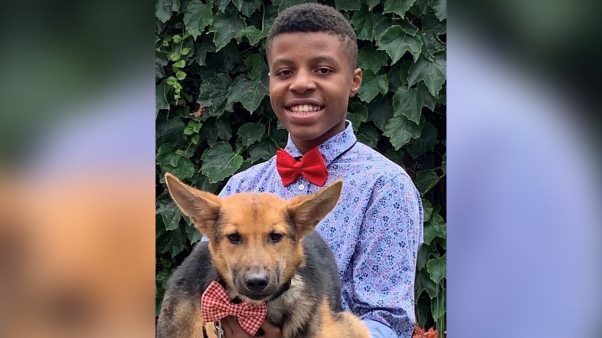Sir Darius Brown poses with a dog wearing one of his original bow ties. (Credit: Dazhai Shearz)