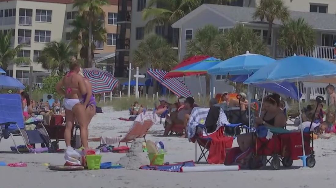 Beachgoers enjoy reopening of Fort Myers Beach at a social distance