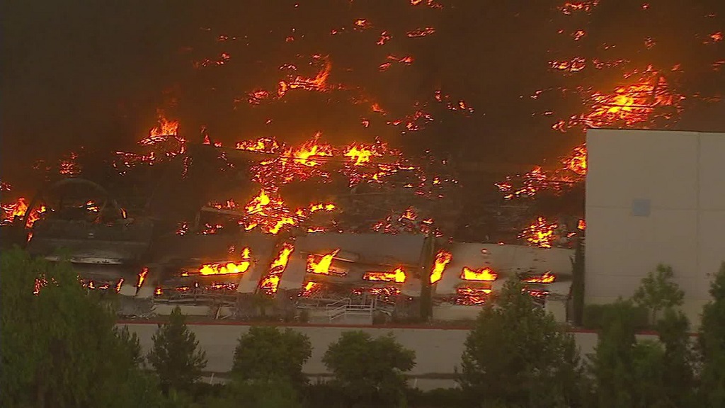 Fire tears through Amazon distribution center in Redlands, California